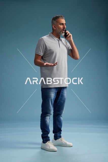 Saudi Man Talking on Smartphone in Casual Clothes