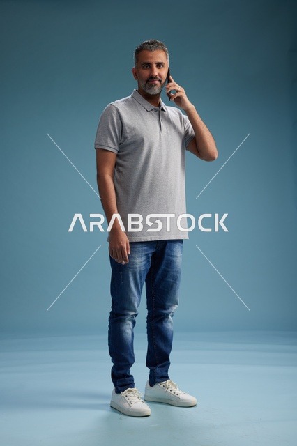 Saudi Man Talking on Mobile Phone in Studio