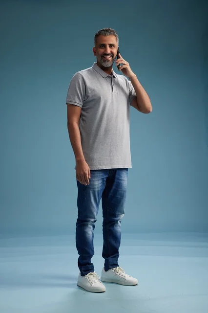 Saudi Man in Casual Wear Talking on Mobile Phone