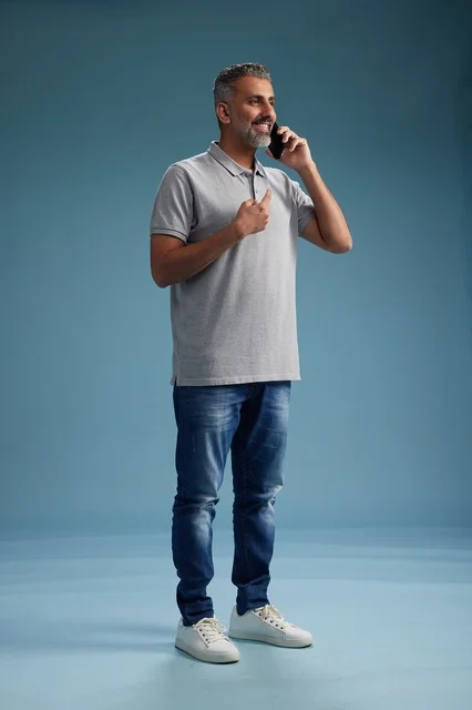 Saudi Man in Casual Wear Talking on Mobile Phone