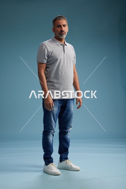 Standing Saudi Man in Casual Clothes on Blue Background