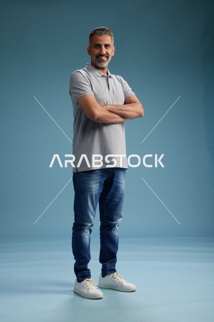 Saudi Man in Casual Wear on Blue Studio Background