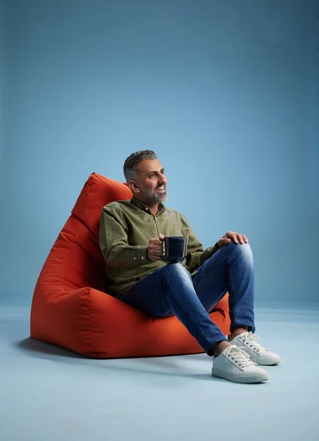 Saudi Man on Bean Bag Chair with Coffee
