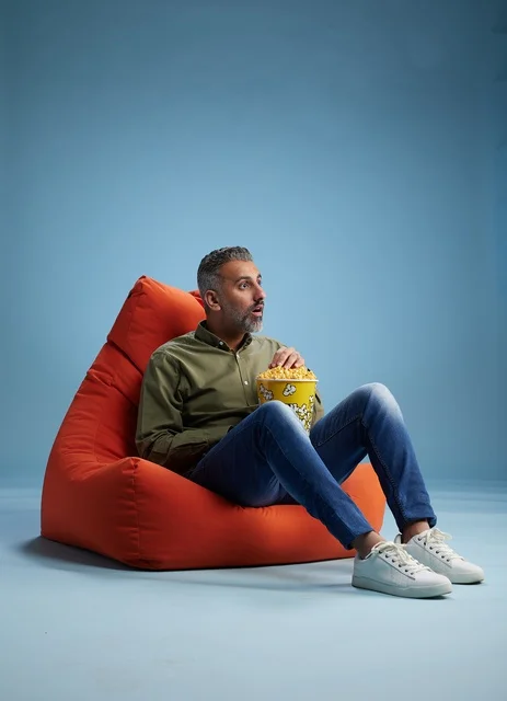 Saudi Man Eating Popcorn on Bean Bag Surprised