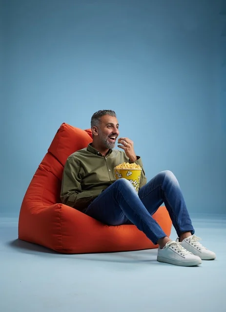 Saudi Man Eating Popcorn on Bean Bag Studio Shot