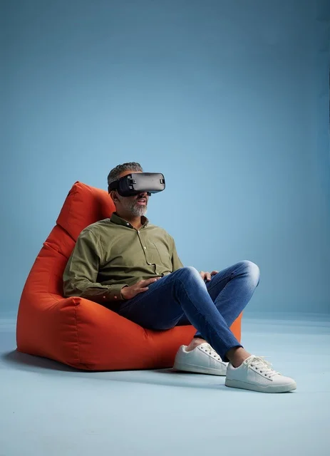 Man in VR Headset Sitting on Bean Bag Chair