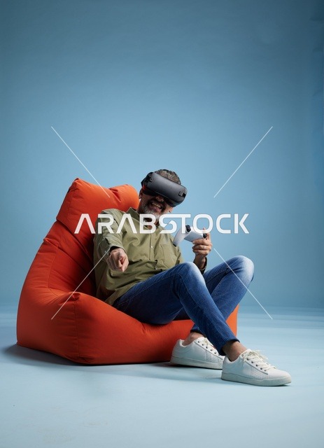 Man Wearing VR Headset on Red Beanbag Chair
