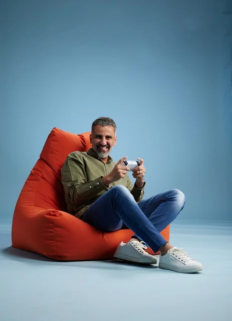 Saudi Man Playing Video Games on Bean Bag Chair