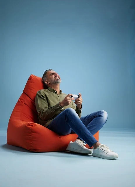 Saudi Man Playing Video Games on Beanbag Chair
