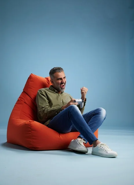 Saudi Man Playing Video Games on Beanbag