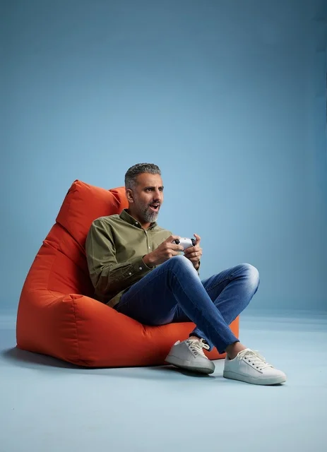 Saudi Man Playing Video Games on Beanbag Chair