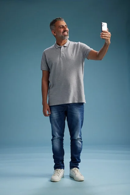 Middle-Aged Arab Man Taking Selfie in Studio