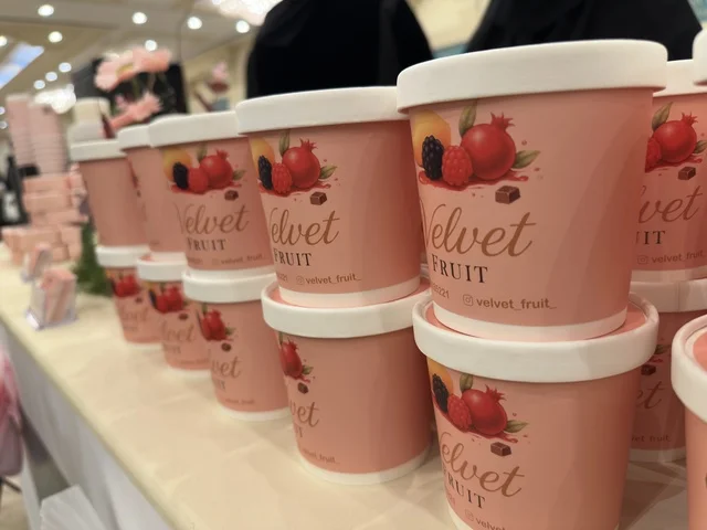 Velvet Fruit ice cream containers at the Ramadan Souk event at Al-Qusaybi Hotel in the Eastern Province, a traditional Ramadan event that brings together the atmosphere of the holy month, popular shops, local products, Ramadan foods, handicrafts, and traditional gifts, in a warm cultural and social experience that reflects the spirit of Ramadan and Saudi authenticity within a luxurious hotel setting.