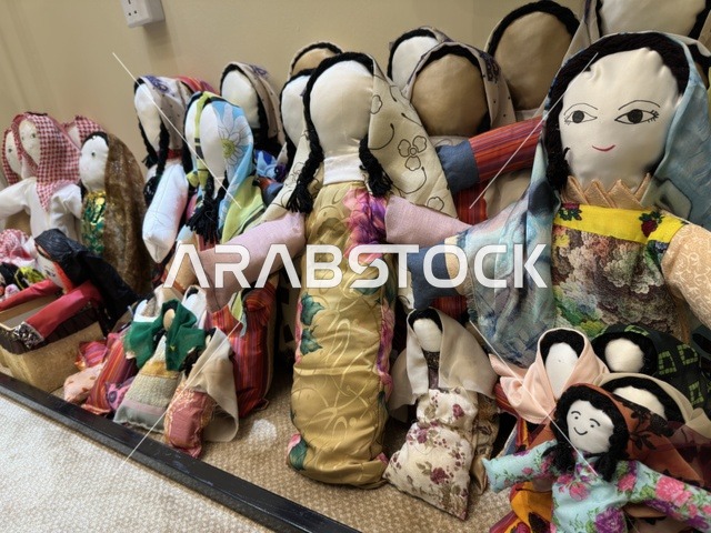 Traditional Saudi fabric dolls at the Ramadan Souk event at Al-Qusaybi Hotel in the Eastern Province, a heritage Ramadan event that brings together the atmosphere of the holy month, popular shops, local products, Ramadan foods, handicrafts, and traditional gifts, in a warm cultural and social experience that reflects the spirit of Ramadan and Saudi authenticity within a luxurious hotel setting.