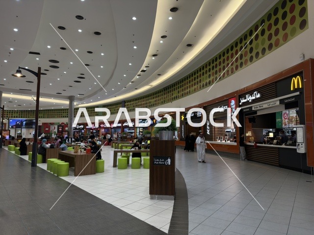Chairs and tables for fast food, Dhahran is the largest and most prominent shopping mall in the Eastern Province of the Kingdom of Saudi Arabia, shopping centers and luxury stores, enhancing the visitor experience and improving facilities, places for family entertainment activities.