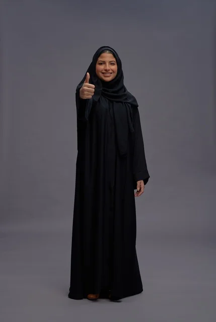 Saudi Woman in Black Abaya Giving Thumbs Up