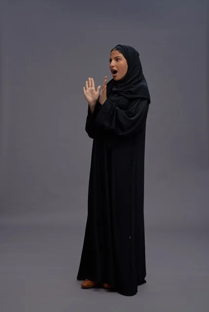 Saudi Woman in Black Abaya Expressing Surprise