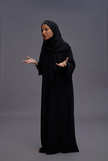 Saudi Woman in Black Abaya Talking in Studio