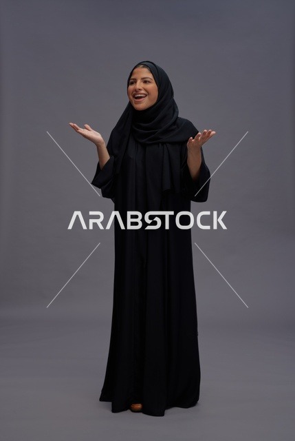 Saudi Woman in Traditional Black Abaya Gesturing in Studio