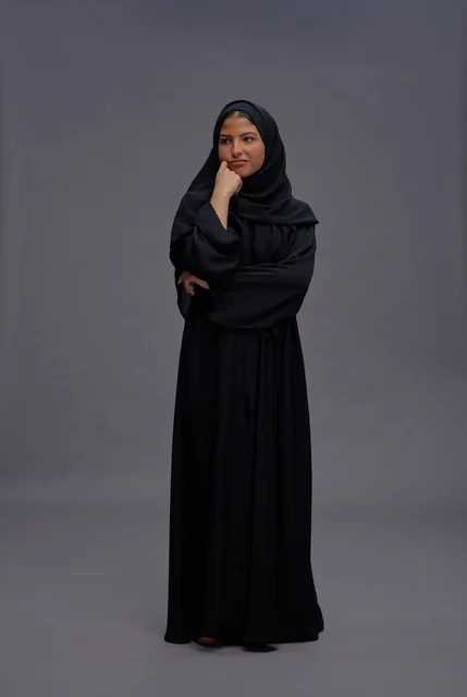 Saudi Woman in Black Abaya Thinking Pose in Studio