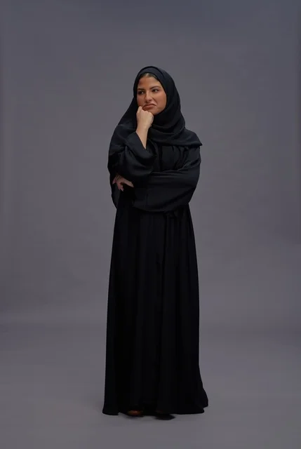 Saudi Woman in Black Abaya Thinking in Studio