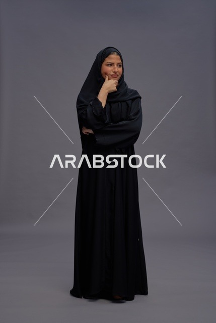 Saudi Woman in Traditional Abaya Standing in Studio
