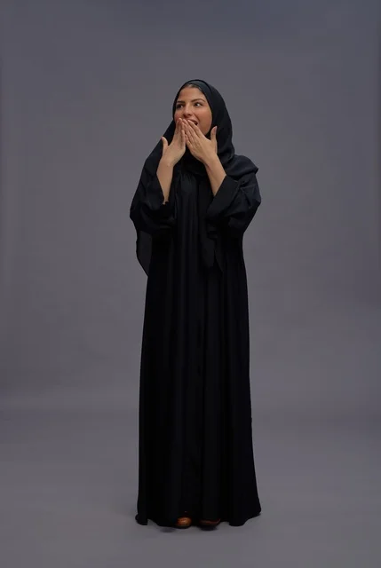 Saudi Woman in Black Abaya with Surprised Expression