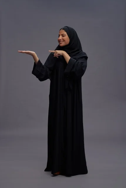 Saudi Woman in Black Abaya Giving a Presentation Pose
