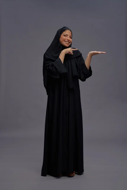 Saudi Woman in Black Abaya Presenting with Hand Gesture