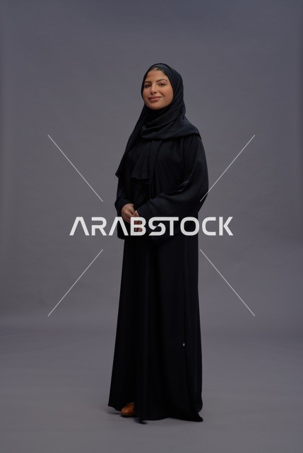 Saudi Woman Wearing Traditional Black Abaya in Studio