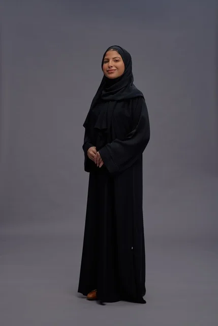 Saudi Woman Wearing Traditional Black Abaya in Studio