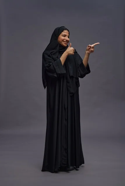 Saudi Woman in Black Abaya Giving Thumbs Up
