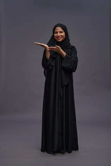 Saudi Woman in Traditional Black Abaya Gesturing in Studio