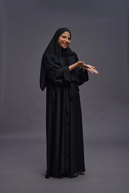 Saudi Woman in Traditional Black Abaya Gesturing
