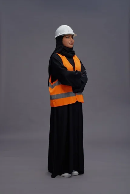 Saudi Female Engineer in Safety Vest and White Hard Hat