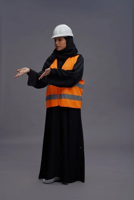 Arab Female Engineer in Safety Vest Presenting