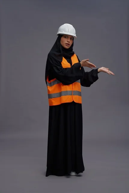 Saudi Female Engineer in Safety Vest Gesturing in Studio