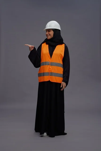 Saudi Female Engineer in Safety Vest Pointing
