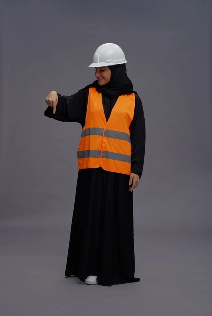 Arab Female Engineer in Safety Vest Pointing Down Studio