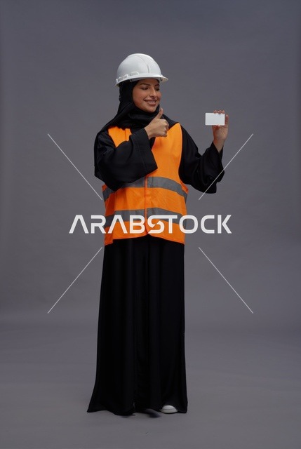 Arab Female Engineer Holding Blank Card and Thumbs Up