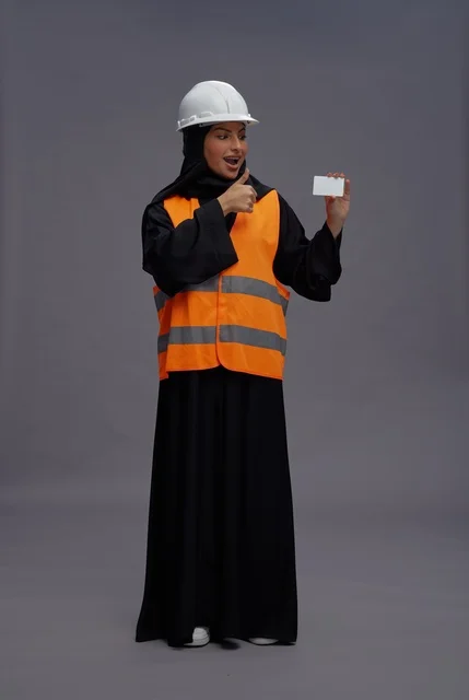 Saudi Female Engineer Holding Blank Card Thumbs Up