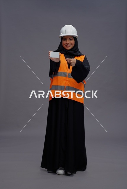 Arab Female Engineer Holding Blank Card in Studio