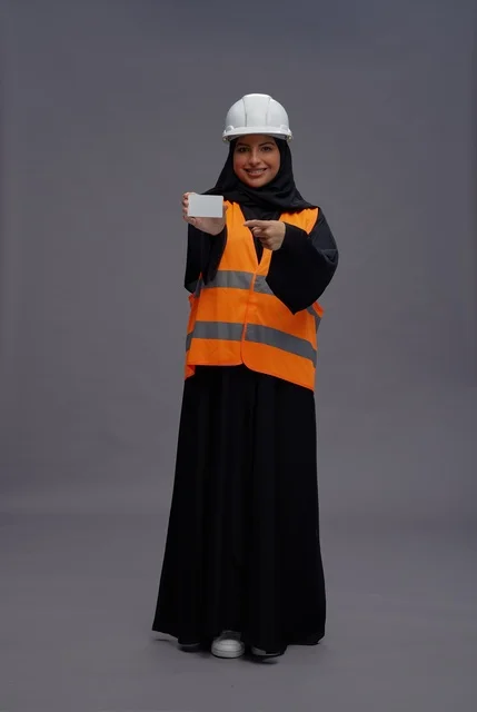 Arab Female Engineer Holding Blank Card in Studio