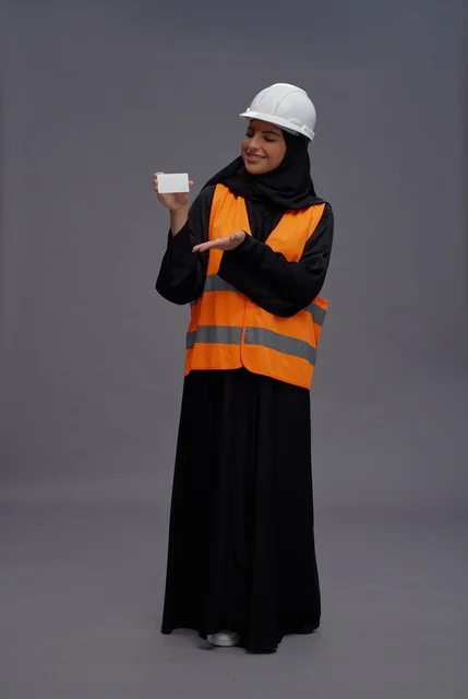 Saudi Female Engineer Holding Blank Card Saudi Female Engineer Holding Blank Card
