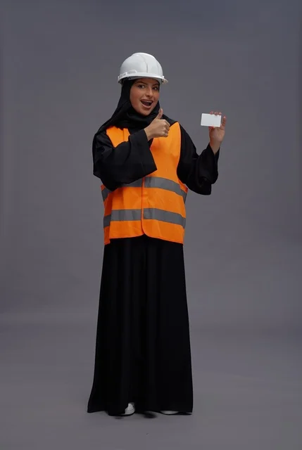 Saudi Female Engineer Holding Card with Thumbs Up