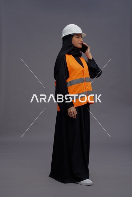 Saudi Female Engineer on Phone with White Safety Helmet