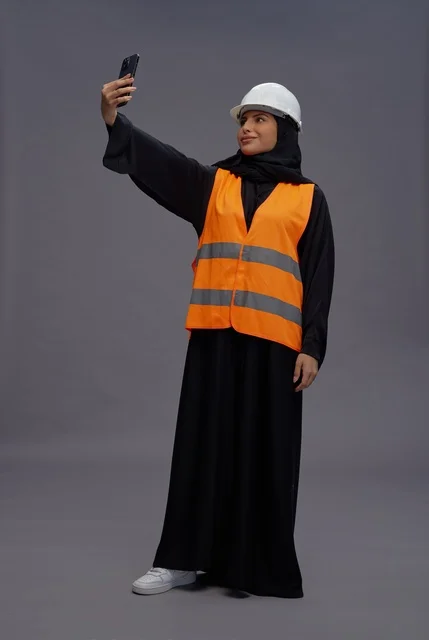 Saudi Female Engineer in Safety Vest Taking Selfie