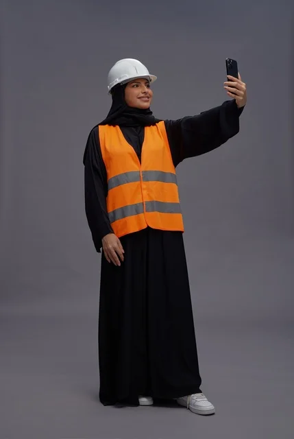 Saudi Female Engineer in Safety Vest Taking Selfie