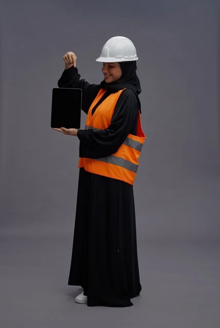 Saudi Female Engineer Holding Tablet with Blank Screen