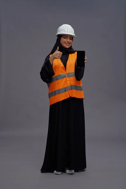 Saudi Female Engineer with Smartphone and Thumbs Up
